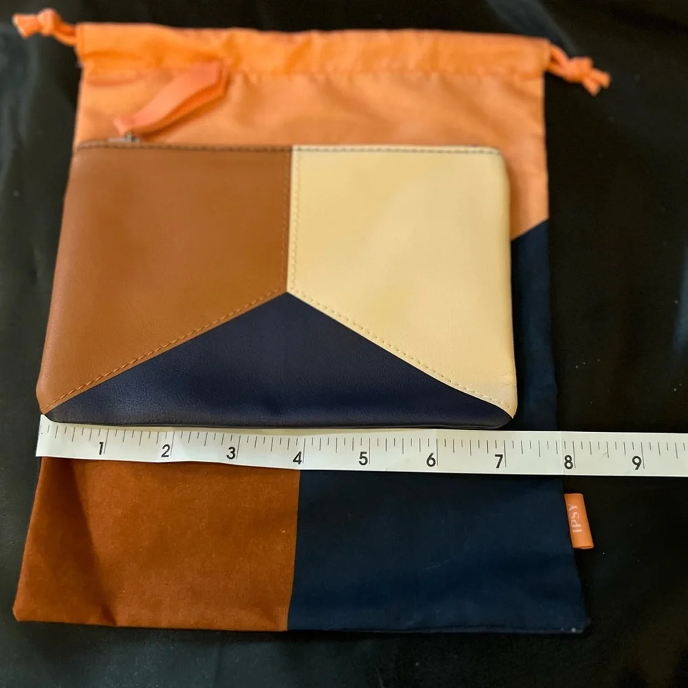 2 Ipsy bags, never used. One is a drawstring cloth bag and the other zips.